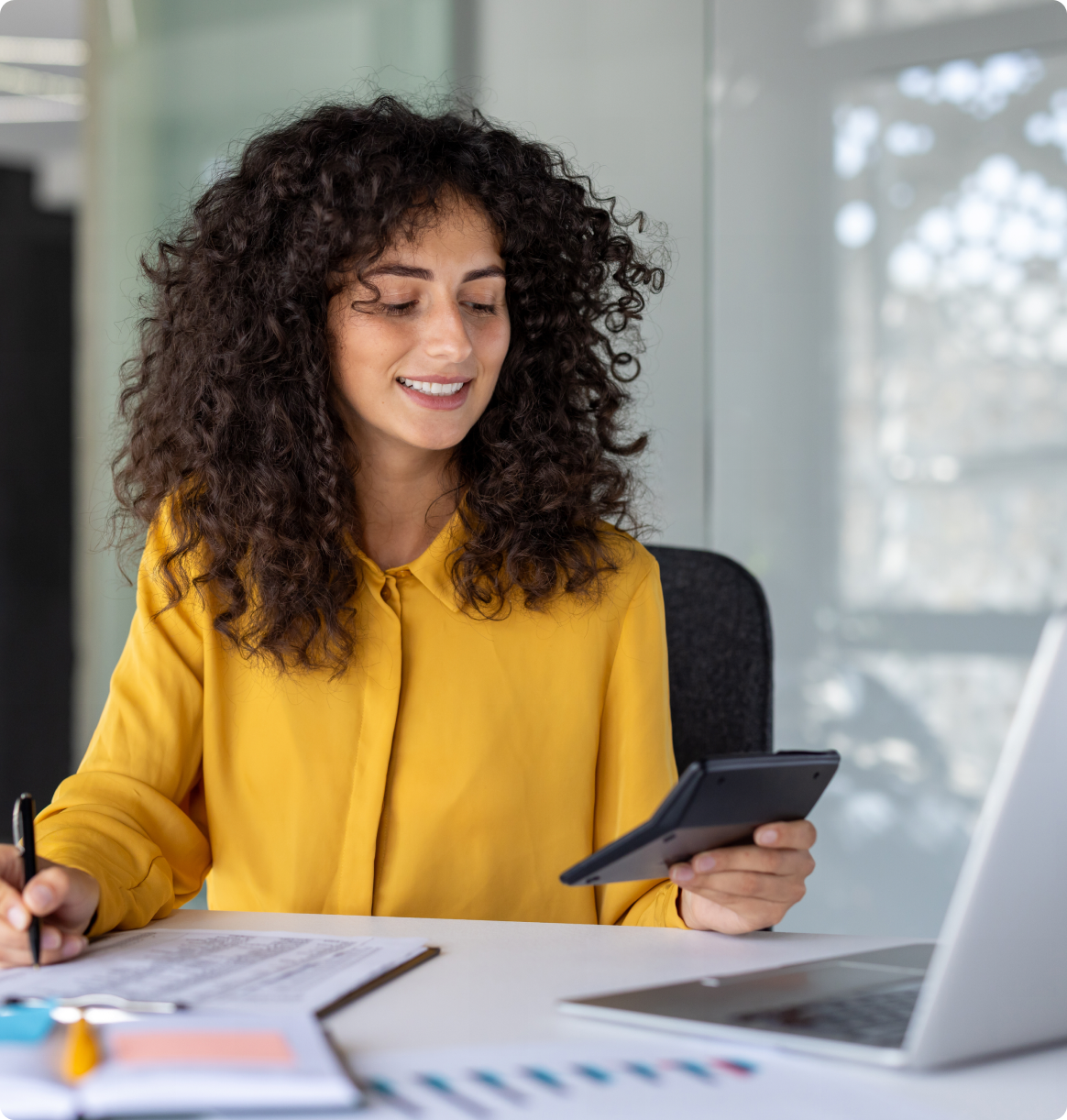 Professional woman in yellow shirt at desk