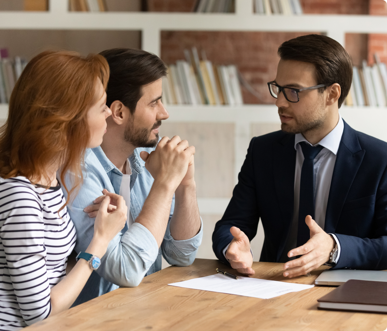 Couple consulting with a professional advisor