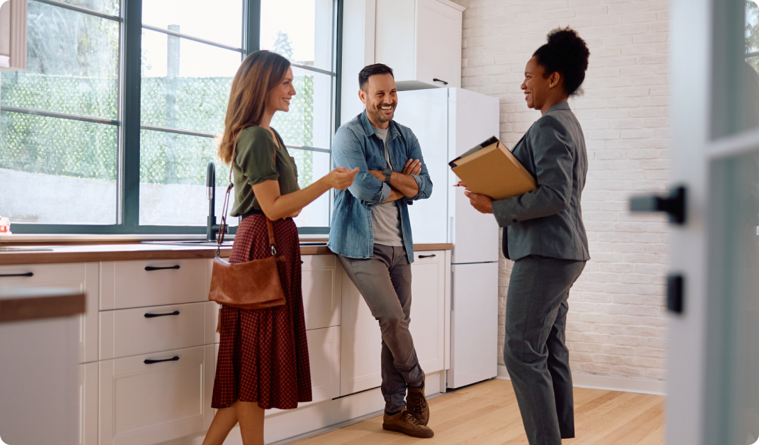 Group chatting in bright kitchen